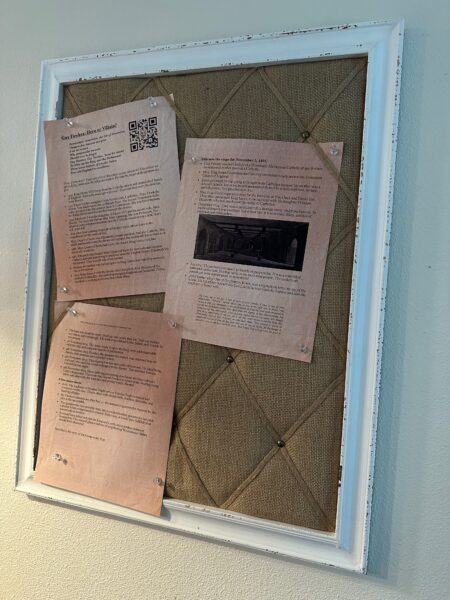 Guy Fawks dossier and facts, printed and attached to a pinboard.